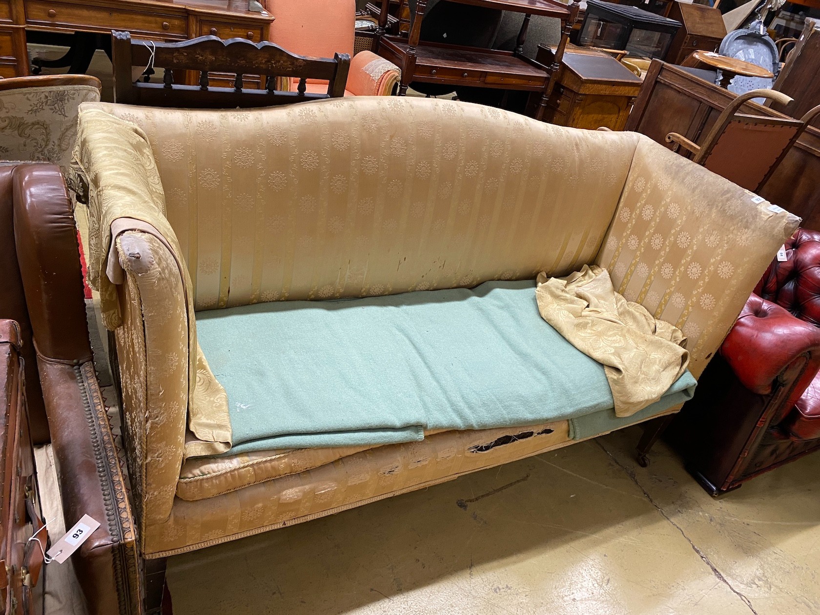 A 19th century upholstered settee on squared tapering legs with castors, length 166cm, width 63cm, height 98cm